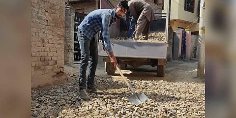 Residents paving the road in Srinagar. (Photo | Special Arrangement)