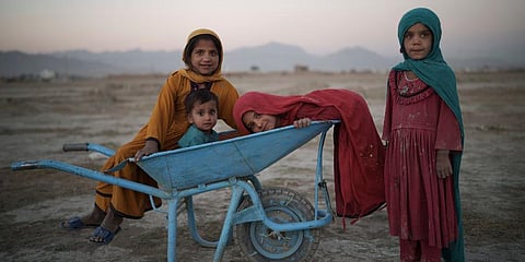 Children pose for a photo as they play in a camp for internally displaced people in Kabul, Afghanistan, Sept 13, 2021. (File Photo | AP)