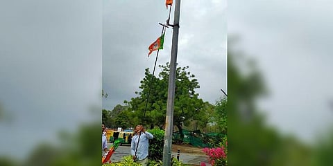 A NDMC officials removes the party flag from a pole on Thursday | express