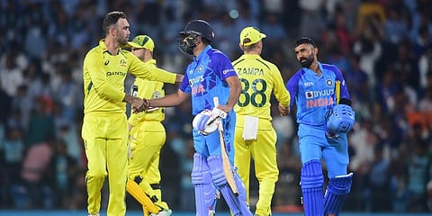 Indian captain Rohit Sharma and batter Dinesh Kartik being greeted by Australian players after winning the 2nd T20 cricket match. (Photo | PTI)