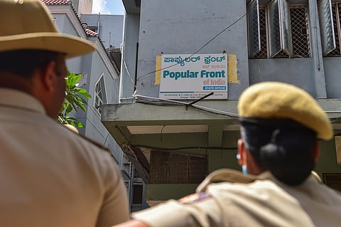 Security personnel keep vigil outside the Popular Front of India (PFI) party office (Photo | PTI)