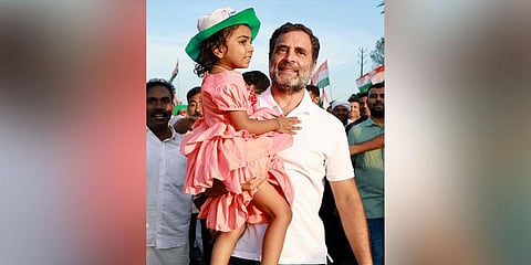 Congress leader Rahul Gandhi with a girl during the Bharat Jodo Yatra at Angamaly