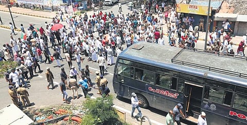 Popular Front activists block Banerjee Road near High Court junction in Kochi on Friday | T P Sooraj