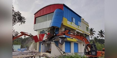 A file photo of BDA razing an illegal building in Karanth Layout.