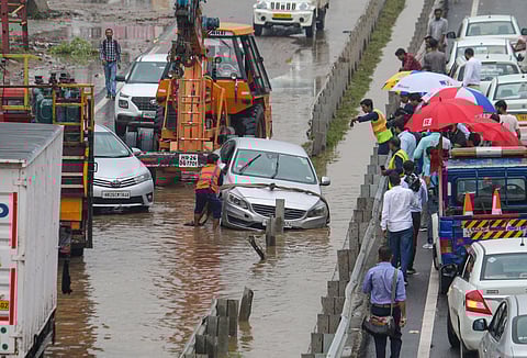 A vehicle stuck on the waterlogged Delhi-Gurugram Expressway (Photo | PTI)