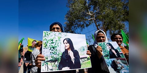 Syrian Kurdish women take part in a demonstration to express their support for 22-year-old Mahsa Amini who died while in the custody of Iranian authorities. (Photo | AFP)