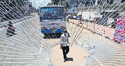 The windshield of a KSRTC bus broken following stone pelting in the PFI hartal in capital city