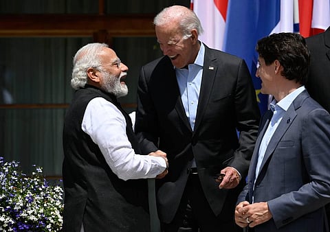 PM Narendra Modi seen with US President Biden and Canadian PM Trudeau at the G-7 summit. Modi might have more reasons to laugh than Biden or Trudeau in a closed economy. (AFP)