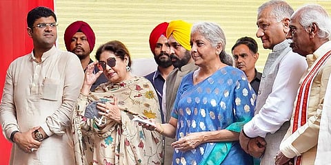 Finance Minister Nirmala Sitharaman, Union MoS for Civil Aviation VK Singh, and others during an event for the renaming of Chandigarh International Airport. (Photo | PTI)