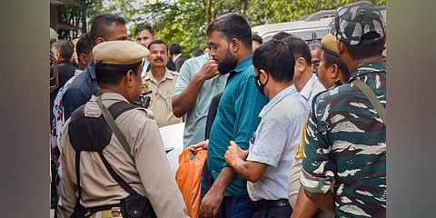 A member of Popular Front of India (PFI) arrested by Assam Police being produced before a court in Guwahati (Photo | PTI)