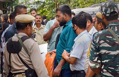 A member of Popular Front of India (PFI) arrested by Assam Police being produced before a court in Guwahati. (Photo | PTI)