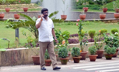 Jharkhand Chief Minister Hemant Soren speaks on the phone as he arrives to chair a special meeting on the drought situation in the state, in Ranchi. (Photo | PTI)