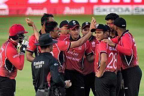 Hong Kong's Ehsan Khan, second left, celebrates with teammates after taking wicket of Pakistan's Babar Azam during the T20 cricket match of Asia Cup. (Photo | PTI)