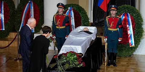 People stand by the coffin of former Soviet President Mikhail Gorbachev inside the Pillar Hall of the House of the Unions during a farewell ceremony in Moscow. (Photo | AP)