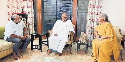 Union Finance Minister Nirmala Sitharaman calls on former PM HD Deve Gowda at his residence, as his son HD Kumaraswamy looks on, in Bengaluru on Thursday