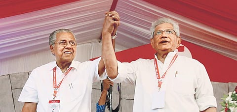 CPM general secretary Sitaram Yechury and Kerala Chief Minister Pinarayi Vijayan greeting party workers at a public meeting.