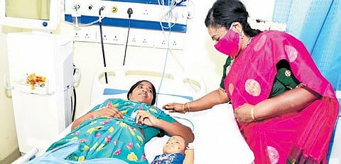Governor Tamilisai Soundararajan checks up on a woman undergoing treatment for post-surgery complications at NIMS on Sunday