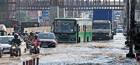 Vehicles wade through the flooded Outer Ring Road near RMZ Ecospace in Bengaluru on Monday as the city recorded highest rainfall of over 131 mm in September. The IMD has issued a heavy rainfall alert