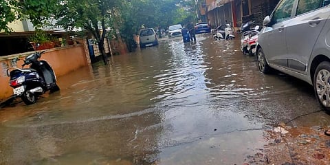 Scene on 7th Cross in front of Fern Saroj Apartments. The water overflow impacted traffic on all neighbouring roads.
