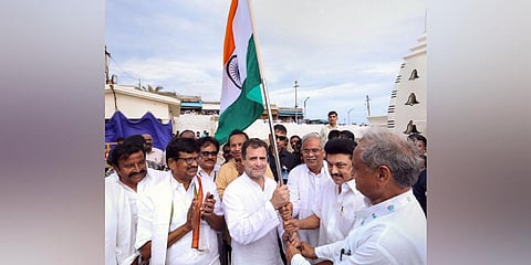 Tamil Nadu CM Stalin, Rajasthan CM Gehlot and Chhattisgarh CM Baghel hand over the national flag to Rahul Gandhi at the 'Bharat Jodo Yatra' launch in Kanyakumari. (Photo | CMO Tamil Nadu Twitter)