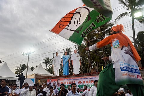 A Congress supporter waves a party flag during the launch of 'Bharat Jodo Yatra', in Kanyakumari, Wednesday, Sept. 7, 2022. (Photo | PTI)