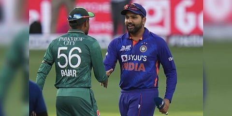 India's captain Rohit Sharma, right, shake hands with Pakistan captain Babar Azam after the toss ahead of the T20 cricket match of Asia Cup between India and Pakistan, in Dubai. (Photo | AP)