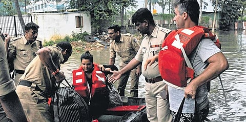 Fire personnel rescue expats Daniel and Premika from their villa in Bengaluru on Wednesday | Vinod Kumar T