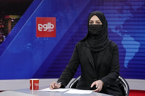 Khatereh Ahmadi a TV anchor wears a face covering as she reads the news on TOLO NEWS, in Kabul, Afghanistan, Sunday, May 22, 2022. (Photo | AP)