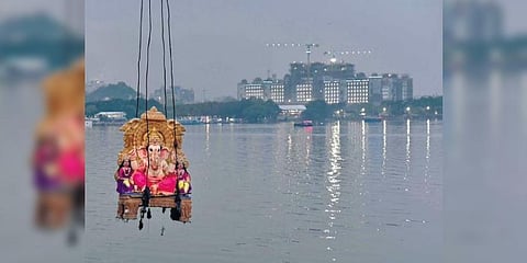 A Ganesh idol being lowered into the Hussainsagar on Thursday | Jwala