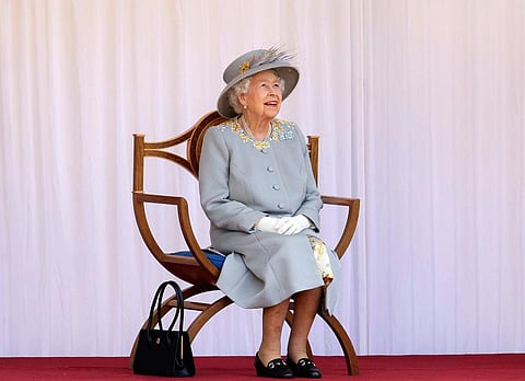 Britain's Queen Elizabeth II watches the red arrows fly over to mark her official birthday at Windsor Castle, Windsor, England. (Photo | AP)