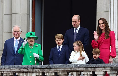 Britain's Queen Elizabeth II stands on Buckingham Palace balcony with Prince Charles. (File photo | AP)
