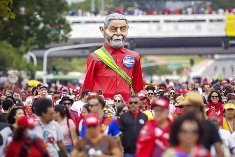 Supporters of President-elect Luiz Inacio Lula da Silva gather to attend his inauguration along the central avenue in Brasilia, Brazil, Sunday, Jan. 1, 2023. (Photo | AP)