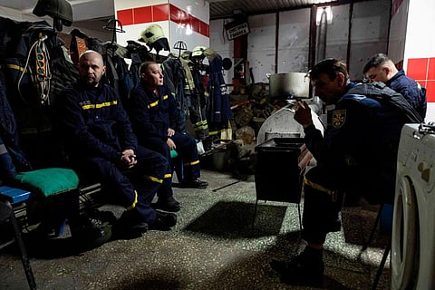 Ukrainian firefighters in the city of Bakhmut, eastern Ukraine, on December 31, 2022. (Photo | AFP)