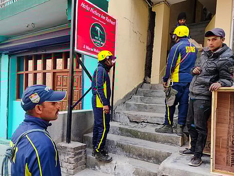 SDRF personnel at a hotel after cracks appeared in Joshimath on Monday. (Photo | PTI)