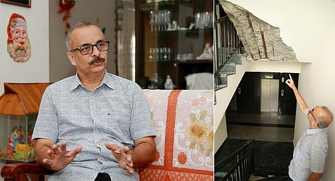 Colonel Ciby George pointing out the portion where a concrete block has come off.( Photo | T P Sooraj, EPS)