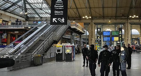Police officers secure the access to Eurostar trains linking France to Britain, at the Gare du Nord train station, on Jan 11, 2023. (Photo | AP)