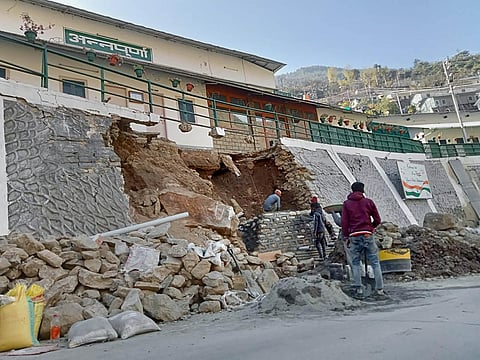 Repair work underway following collapse of a wall in Joshimath area of Chamoli district, Tuesday, Jan. 10, 2023. (Photo | PTI)