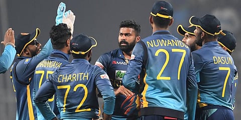 Sri Lanka's Lahiru Kumara (C) celebrates with teammates after taking the wicket of India's Virat Kohli during the second ODI cricket match between India and Sri Lanka in Kolkata. (Photo | AFP)