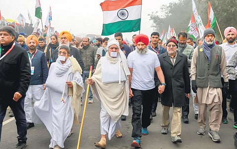 Congress leader Rahul Gandhi walks with Jain monks and supporters during the party’s ‘Bharat Jodo Yatra’ in Fatehgarh Sahib on Wednesday | PTI