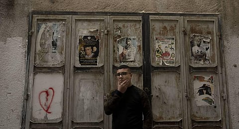 Yousef Mesheh, 15, who was detained along with his brother in a 3 a.m. raid by Israeli forces, stands in an alleyway in the Balata Refugee Camp in the northern West Bank. (Photo | AP)