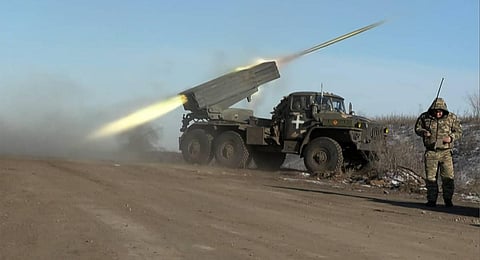 AFP video footage shows a member of Ukraine's military looking away as a BM-21'Grad' MLRS 122mm rocket launcher fires on the outskirts of Soledar. (Photo | AFP)