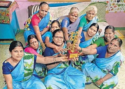 Members of Tanwa with the award they received from the chief minister for the best self-help group in Tamil Nadu | Express