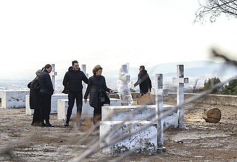 Anne-Marie, wife of the Former King Constantine II of Greece, second right, inspects a cemetery at the former summer residence of Greece's royals, in Tatoi, northwestern Athens. (Photo | AP)