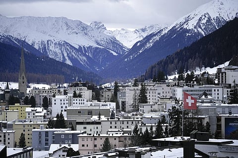 A Swiss national flag waves on a building in Davos, Switzerland on Jan. 15, 2023 | AP