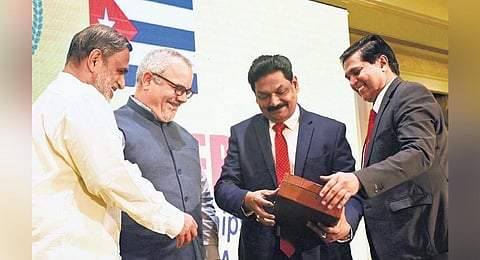 Advocate K G Anilkumar, Trade Commissioner (Cuba), Latin American Federation of India, presenting a memento to Cuban Ambassador to India Alejandro Somance Marin at the India Cuba business forum