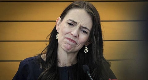 New Zealand Prime Minister Jacinda Ardern grimaces as she announces her resignation at a press conference in Napier, New Zealand Thursday. (Photo | AP)