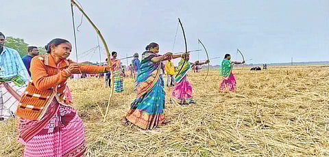 Tribal women undergoing archery training at a village in Kendrapara | Express