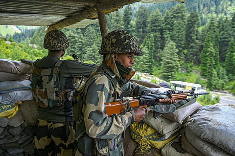Two Border Security Force (BSF) personnel stand guard in the Ganderbal district of Jammu and Kashmir. (File Photo | PTI)