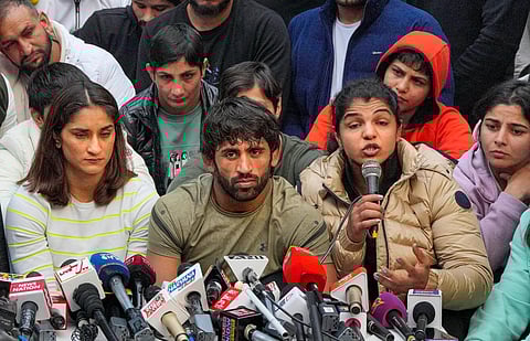 Wrestlers Vinesh Phogat (L), Sakshi Malik (R) and Bajrang Punia address a press conference in New Delhi on Thursday, Jan. 19, 2023. (Photo | PTI)
