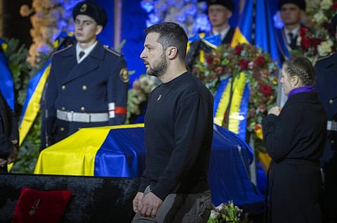 Ukrainian President Volodymyr Zelenskyy pays his respects to victims of a deadly helicopter crash during a farewell ceremony in Kyiv, Ukraine. (Photo | AP)